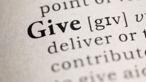 Photo of dictionary definition of the word give.