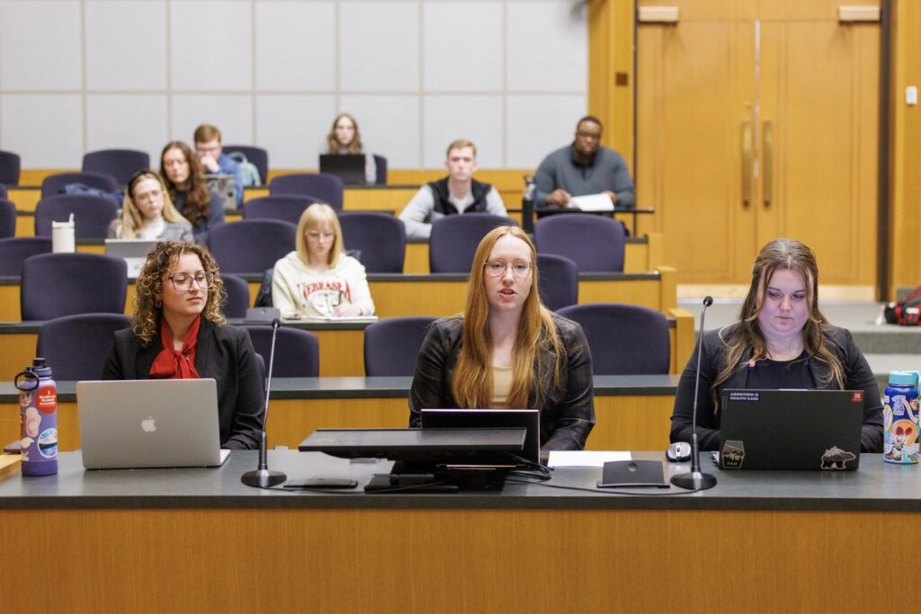 Students sit in a lecture room in UNL College of Law