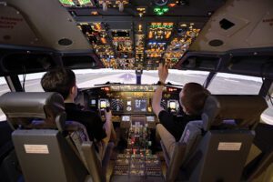 UNO Aviation’s newest flight simulator, a Boeing 737, is flown by students Jonathan Corey and Hunter Pherson.